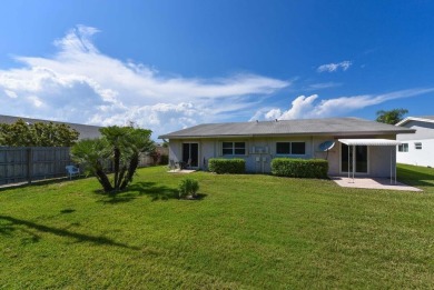 RARE HALF DUPLEX WITH PRIVATE BACKYARD! This 2-bedroom on Cypress Lakes Golf Course - West Palm Beach in Florida - for sale on GolfHomes.com, golf home, golf lot