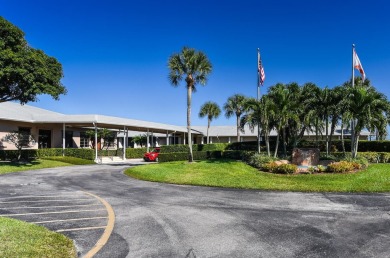 RARE HALF DUPLEX WITH PRIVATE BACKYARD! This 2-bedroom on Cypress Lakes Golf Course - West Palm Beach in Florida - for sale on GolfHomes.com, golf home, golf lot