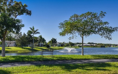 RARE HALF DUPLEX WITH PRIVATE BACKYARD! This 2-bedroom on Cypress Lakes Golf Course - West Palm Beach in Florida - for sale on GolfHomes.com, golf home, golf lot