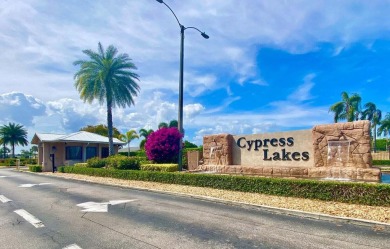 RARE HALF DUPLEX WITH PRIVATE BACKYARD! This 2-bedroom on Cypress Lakes Golf Course - West Palm Beach in Florida - for sale on GolfHomes.com, golf home, golf lot