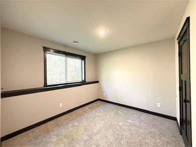 Former model home finally ready for a family to move in and on Inver Wood Golf Course in Minnesota - for sale on GolfHomes.com, golf home, golf lot