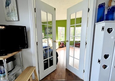 1700+ S.F. 2/bd, 2/ba home w/ Den is situated on a beautiful on Del Tura Golf and Country Club in Florida - for sale on GolfHomes.com, golf home, golf lot