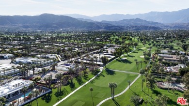 Set on an expansive corner lot along the prestigious Tamarisk on Tamarisk Country Club in California - for sale on GolfHomes.com, golf home, golf lot