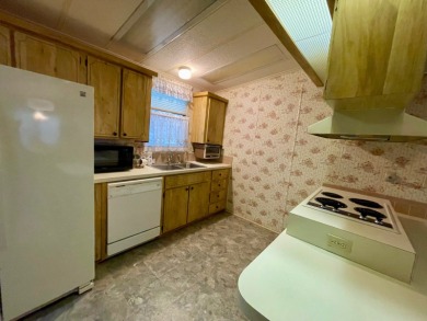 A furnished and well maintained 2bed/2bath home in the 55+ on Rolling Greens Executive Golf Community in Florida - for sale on GolfHomes.com, golf home, golf lot