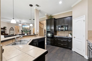 Beautifully situated on a quiet, gated street overlooking Iron on Iron Horse Golf Course in Texas - for sale on GolfHomes.com, golf home, golf lot