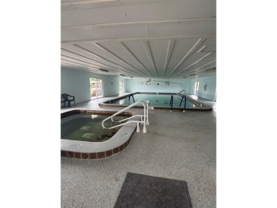 Nestled in the highly sought-after 55+ community of IMPERIAL on Bay Tree Golf Course in Florida - for sale on GolfHomes.com, golf home, golf lot