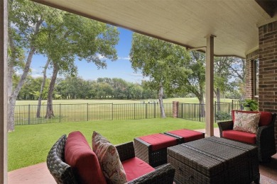 Beautifully situated on a quiet, gated street overlooking Iron on Iron Horse Golf Course in Texas - for sale on GolfHomes.com, golf home, golf lot