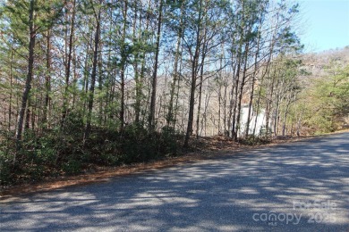 Enjoy stunning views of both Lake Lure and Rumbling Bald on Rumbling Bald Resort on Lake Lure in North Carolina - for sale on GolfHomes.com, golf home, golf lot