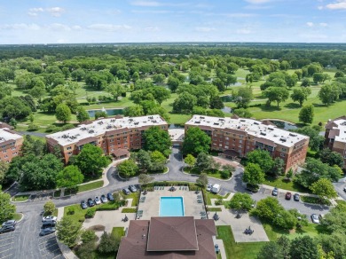 Experience resort-style living in this main floor 2-bed, 2-bath on Old Orchard Country Club in Illinois - for sale on GolfHomes.com, golf home, golf lot