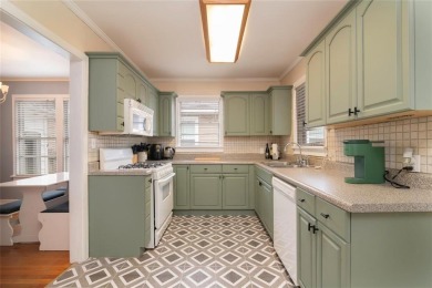 This dollhouse in Broadmoor features a charming kitchen and a on Querbes Park Golf Course in Louisiana - for sale on GolfHomes.com, golf home, golf lot