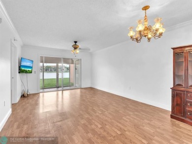Bright & Clean first-floor 2-bedroom, 1.5-bathroom Waterfront on Flamingo Lakes Country Club in Florida - for sale on GolfHomes.com, golf home, golf lot