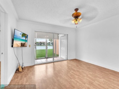 Bright & Clean first-floor 2-bedroom, 1.5-bathroom Waterfront on Flamingo Lakes Country Club in Florida - for sale on GolfHomes.com, golf home, golf lot