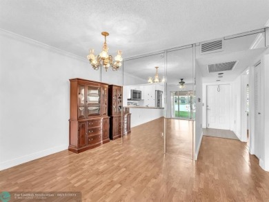 Bright & Clean first-floor 2-bedroom, 1.5-bathroom Waterfront on Flamingo Lakes Country Club in Florida - for sale on GolfHomes.com, golf home, golf lot