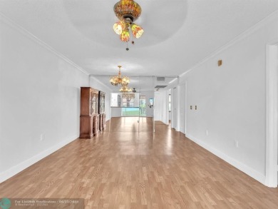 Bright & Clean first-floor 2-bedroom, 1.5-bathroom Waterfront on Flamingo Lakes Country Club in Florida - for sale on GolfHomes.com, golf home, golf lot