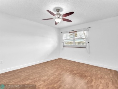Bright & Clean first-floor 2-bedroom, 1.5-bathroom Waterfront on Flamingo Lakes Country Club in Florida - for sale on GolfHomes.com, golf home, golf lot