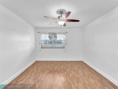 Bright & Clean first-floor 2-bedroom, 1.5-bathroom Waterfront on Flamingo Lakes Country Club in Florida - for sale on GolfHomes.com, golf home, golf lot