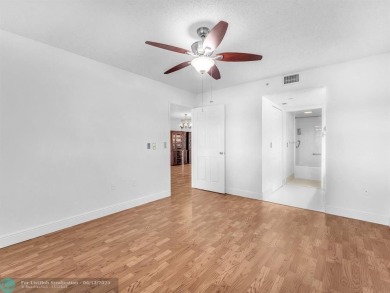 Bright & Clean first-floor 2-bedroom, 1.5-bathroom Waterfront on Flamingo Lakes Country Club in Florida - for sale on GolfHomes.com, golf home, golf lot