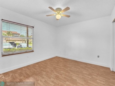 Bright & Clean first-floor 2-bedroom, 1.5-bathroom Waterfront on Flamingo Lakes Country Club in Florida - for sale on GolfHomes.com, golf home, golf lot