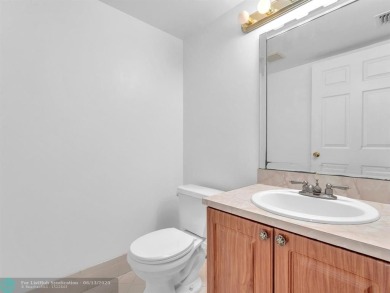 Bright & Clean first-floor 2-bedroom, 1.5-bathroom Waterfront on Flamingo Lakes Country Club in Florida - for sale on GolfHomes.com, golf home, golf lot