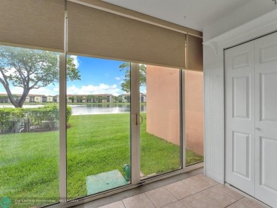 Bright & Clean first-floor 2-bedroom, 1.5-bathroom Waterfront on Flamingo Lakes Country Club in Florida - for sale on GolfHomes.com, golf home, golf lot