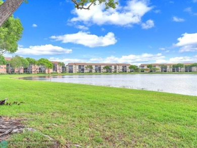 Bright & Clean first-floor 2-bedroom, 1.5-bathroom Waterfront on Flamingo Lakes Country Club in Florida - for sale on GolfHomes.com, golf home, golf lot