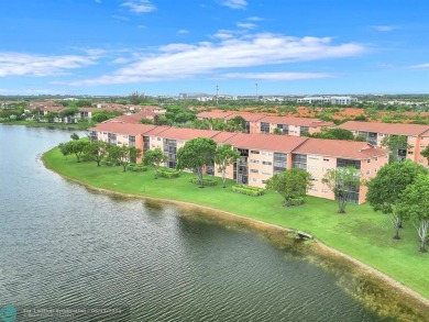 Bright & Clean first-floor 2-bedroom, 1.5-bathroom Waterfront on Flamingo Lakes Country Club in Florida - for sale on GolfHomes.com, golf home, golf lot