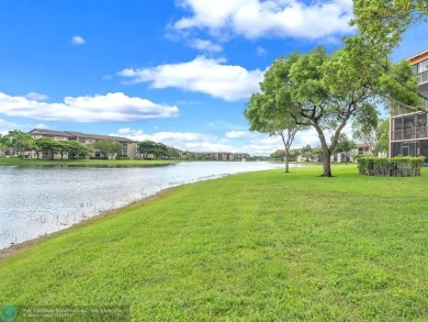 Bright & Clean first-floor 2-bedroom, 1.5-bathroom Waterfront on Flamingo Lakes Country Club in Florida - for sale on GolfHomes.com, golf home, golf lot