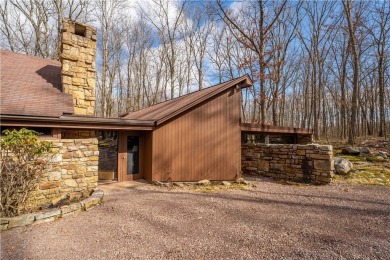 Amazing golf course views from this rustic contemporary home on Nemacolin Woodlands Resort and Spa in Pennsylvania - for sale on GolfHomes.com, golf home, golf lot