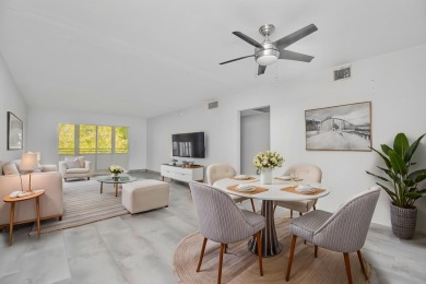 Fully renovated open concept kitchen with s/s appliances, quartz on Wynmoor Golf Course in Florida - for sale on GolfHomes.com, golf home, golf lot