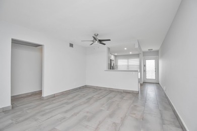 Fully renovated open concept kitchen with s/s appliances, quartz on Wynmoor Golf Course in Florida - for sale on GolfHomes.com, golf home, golf lot