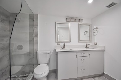 Fully renovated open concept kitchen with s/s appliances, quartz on Wynmoor Golf Course in Florida - for sale on GolfHomes.com, golf home, golf lot