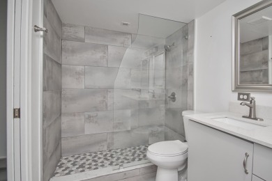 Fully renovated open concept kitchen with s/s appliances, quartz on Wynmoor Golf Course in Florida - for sale on GolfHomes.com, golf home, golf lot