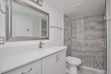 Fully renovated open concept kitchen with s/s appliances, quartz on Wynmoor Golf Course in Florida - for sale on GolfHomes.com, golf home, golf lot