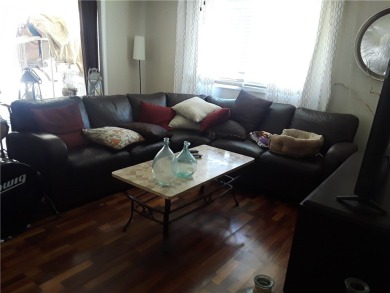 This cozy corner-lot home is full of potential and ready for on Barefoot Bay Golf Course in Florida - for sale on GolfHomes.com, golf home, golf lot