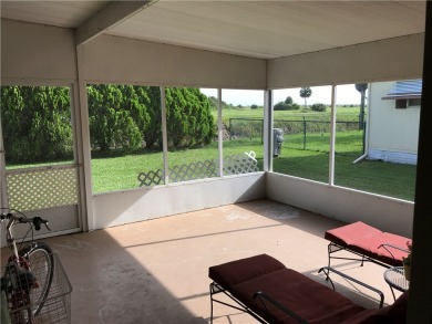 This cozy corner-lot home is full of potential and ready for on Barefoot Bay Golf Course in Florida - for sale on GolfHomes.com, golf home, golf lot