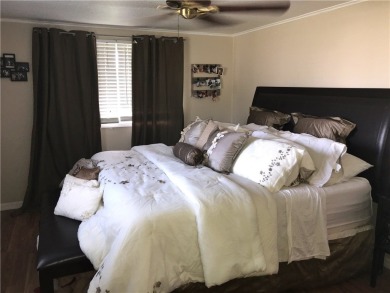 This cozy corner-lot home is full of potential and ready for on Barefoot Bay Golf Course in Florida - for sale on GolfHomes.com, golf home, golf lot