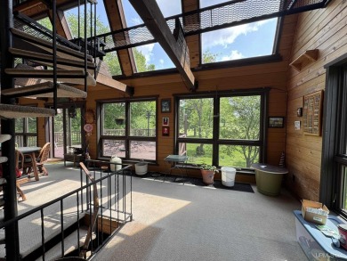 High-Efficiency Solar Home with Golf Course Frontage on 13+/- on Gogebic Country Club in Michigan - for sale on GolfHomes.com, golf home, golf lot