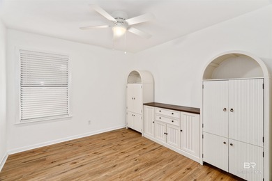 This charming 3 bed/2 bath Lake Forest cottage on a spacious on Lake Forest Yacht and Country Club in Alabama - for sale on GolfHomes.com, golf home, golf lot