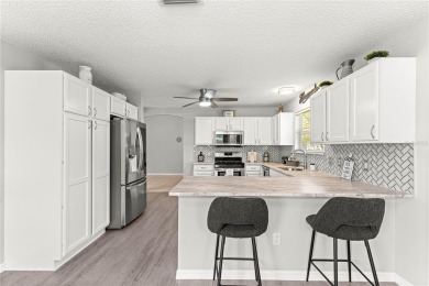 BOND PAID!! NO CARPET!! ROOF 2017!!! Welcome to this charming on El Santiago Executive Golf Course in Florida - for sale on GolfHomes.com, golf home, golf lot