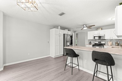 BOND PAID!! NO CARPET!! ROOF 2017!!! Welcome to this charming on El Santiago Executive Golf Course in Florida - for sale on GolfHomes.com, golf home, golf lot