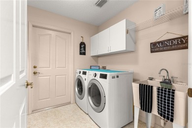 BOND PAID!! NO CARPET!! ROOF 2017!!! Welcome to this charming on El Santiago Executive Golf Course in Florida - for sale on GolfHomes.com, golf home, golf lot