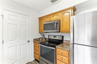 Welcome to this delightful second-floor end-unit condo, offering on East Bay Golf Club in Florida - for sale on GolfHomes.com, golf home, golf lot