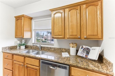 Welcome to this delightful second-floor end-unit condo, offering on East Bay Golf Club in Florida - for sale on GolfHomes.com, golf home, golf lot
