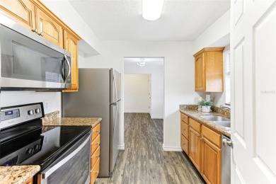 Welcome to this delightful second-floor end-unit condo, offering on East Bay Golf Club in Florida - for sale on GolfHomes.com, golf home, golf lot
