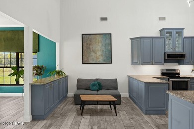 FULLY FURNISHED 5 bedroom 4 bathroom luxurious pool home sits in on Spruce Creek Golf Club in Florida - for sale on GolfHomes.com, golf home, golf lot