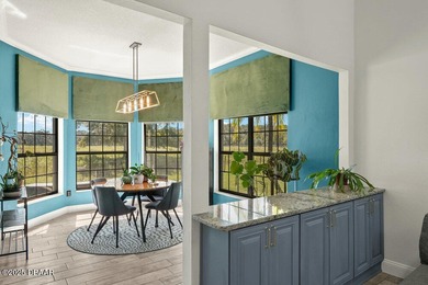 FULLY FURNISHED 5 bedroom 4 bathroom luxurious pool home sits in on Spruce Creek Golf Club in Florida - for sale on GolfHomes.com, golf home, golf lot