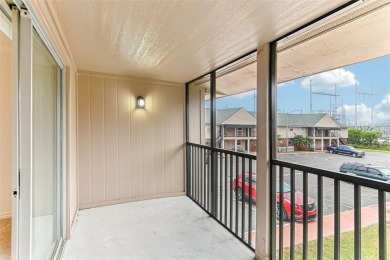 Welcome to this delightful second-floor end-unit condo, offering on East Bay Golf Club in Florida - for sale on GolfHomes.com, golf home, golf lot