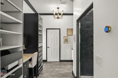 FULLY FURNISHED 5 bedroom 4 bathroom luxurious pool home sits in on Spruce Creek Golf Club in Florida - for sale on GolfHomes.com, golf home, golf lot