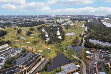 Welcome to this delightful second-floor end-unit condo, offering on East Bay Golf Club in Florida - for sale on GolfHomes.com, golf home, golf lot
