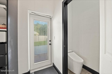 FULLY FURNISHED 5 bedroom 4 bathroom luxurious pool home sits in on Spruce Creek Golf Club in Florida - for sale on GolfHomes.com, golf home, golf lot